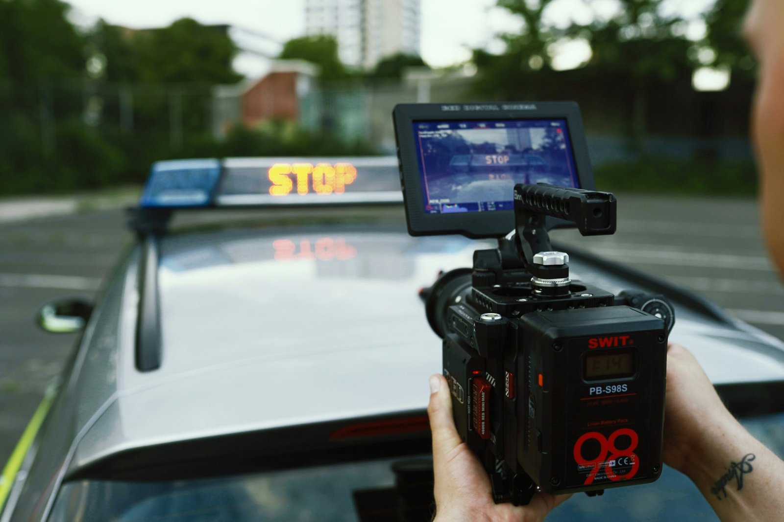 person holding black video camera